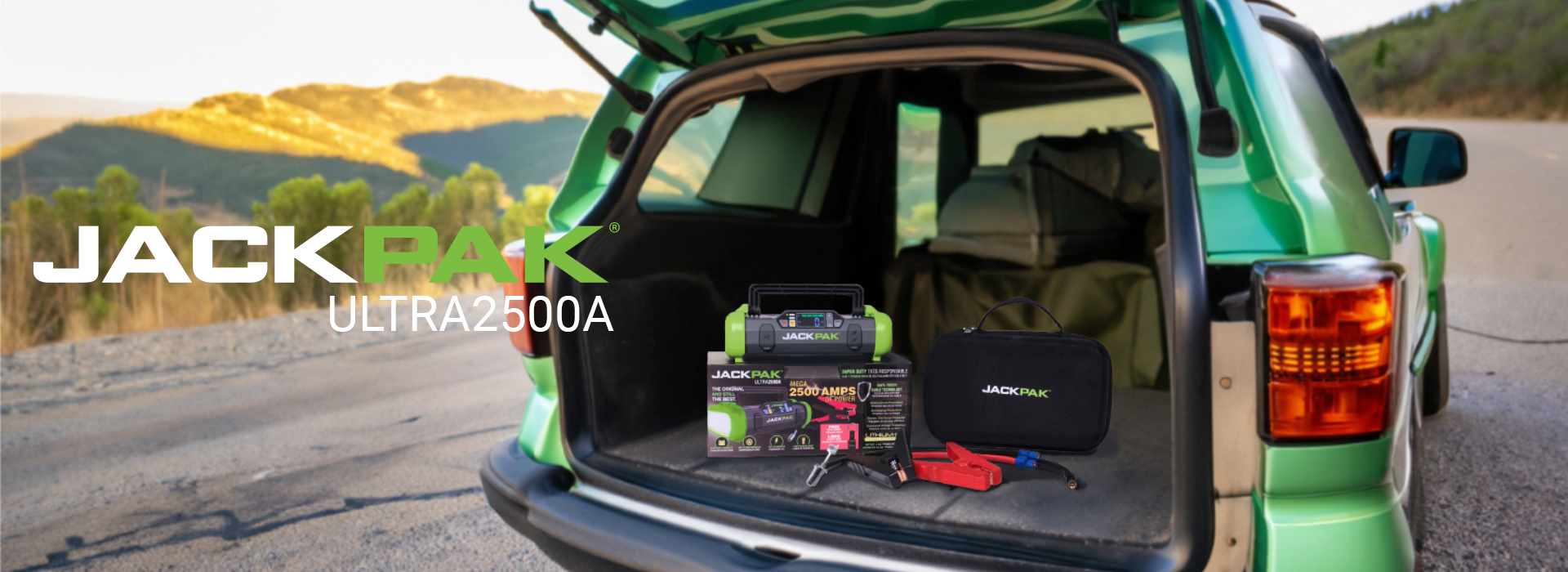 Green SUV with rear hatch open displaying Ultra2500A portable power pack sitting in rear cargo area